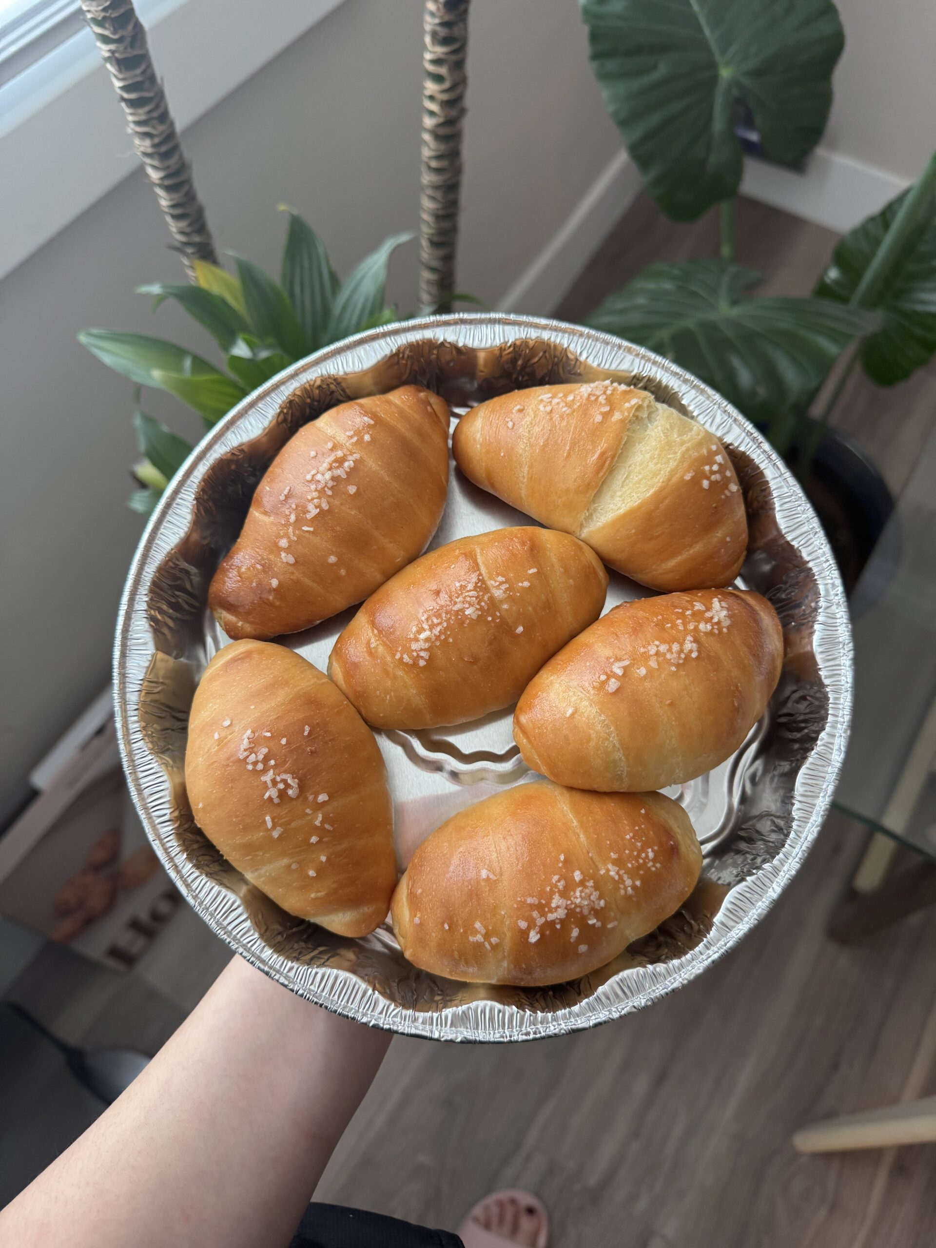 six salt breads in a circular silver pan