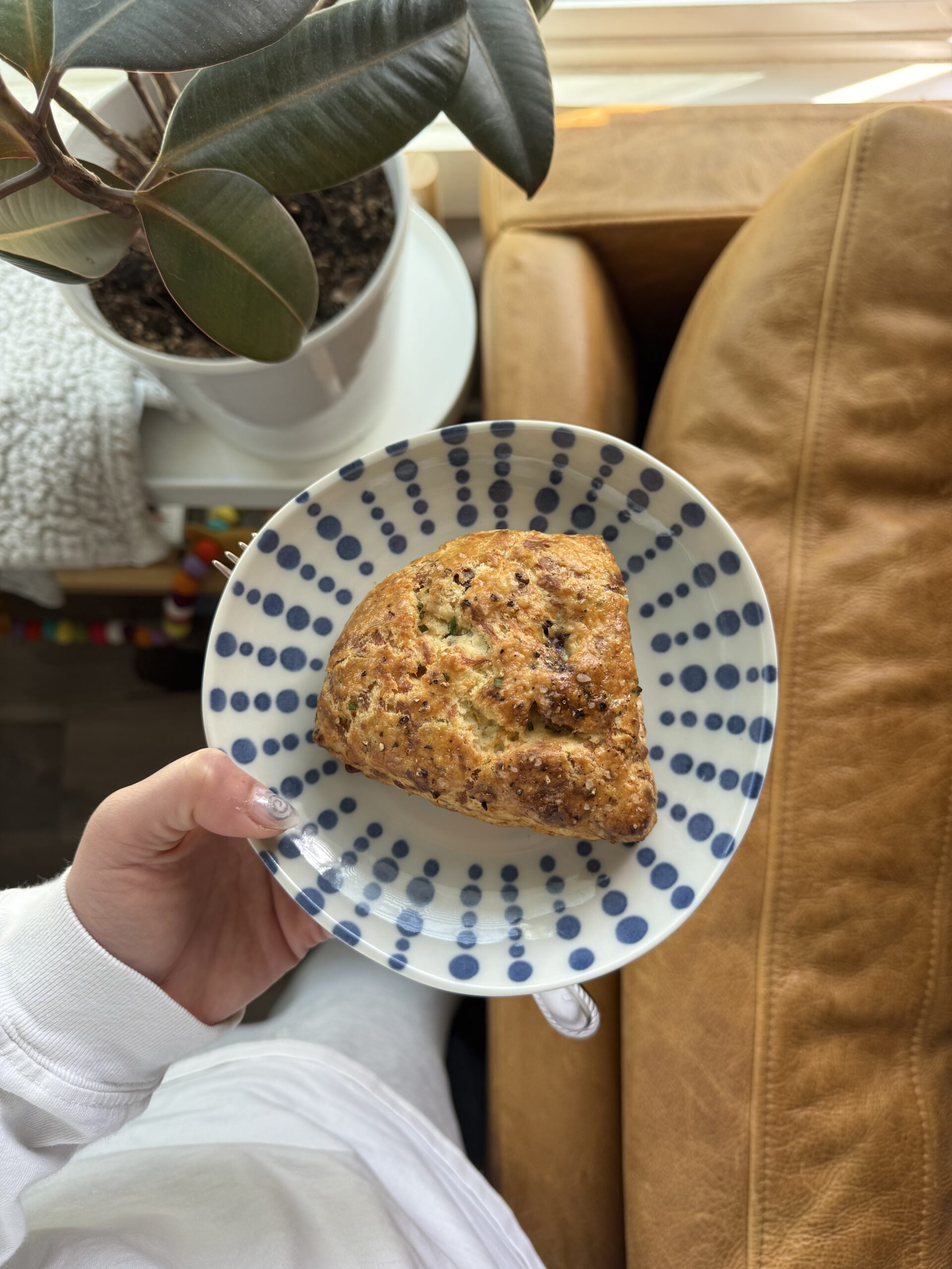 triangular scone on a blue polka dotted plate